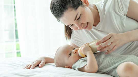 baby-drinking-milk-from-bottle
